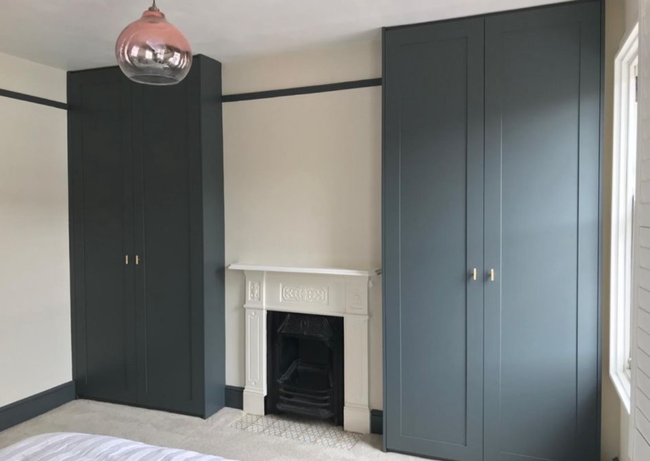 Custom fitted wardrobes with organised internal storage in Berkshire bedroom