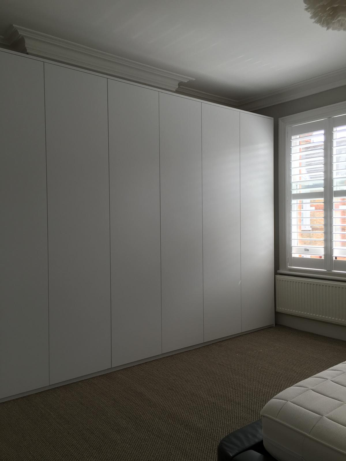 Bespoke fitted wardrobe with internal lighting in Windsor
