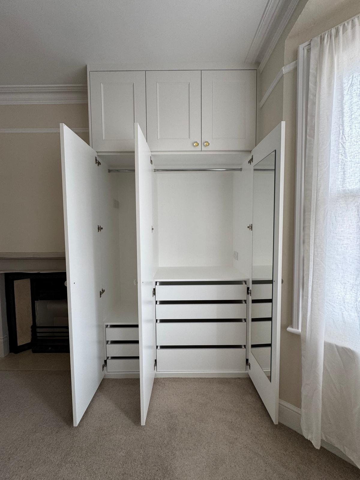 Custom fitted wardrobe with painted finish in Berkshire bedroom