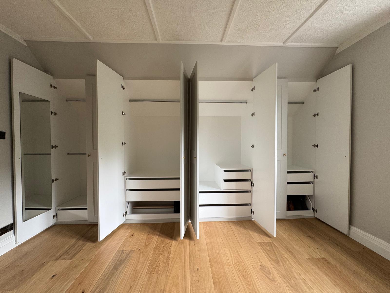 Bespoke dressing room with open shelving and hanging rails in Berkshire