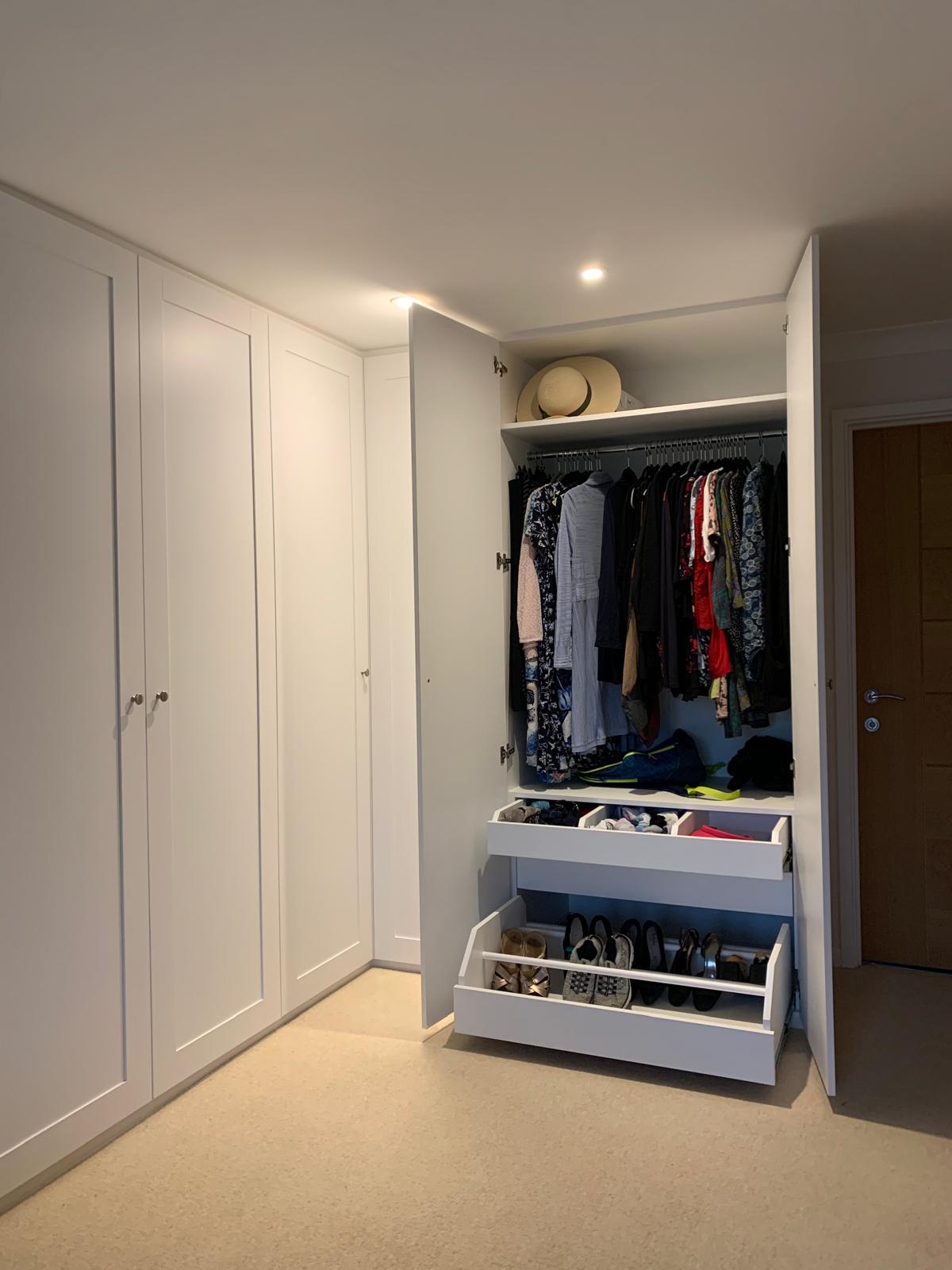 Bespoke walk-in wardrobe with island unit in Maidenhead home