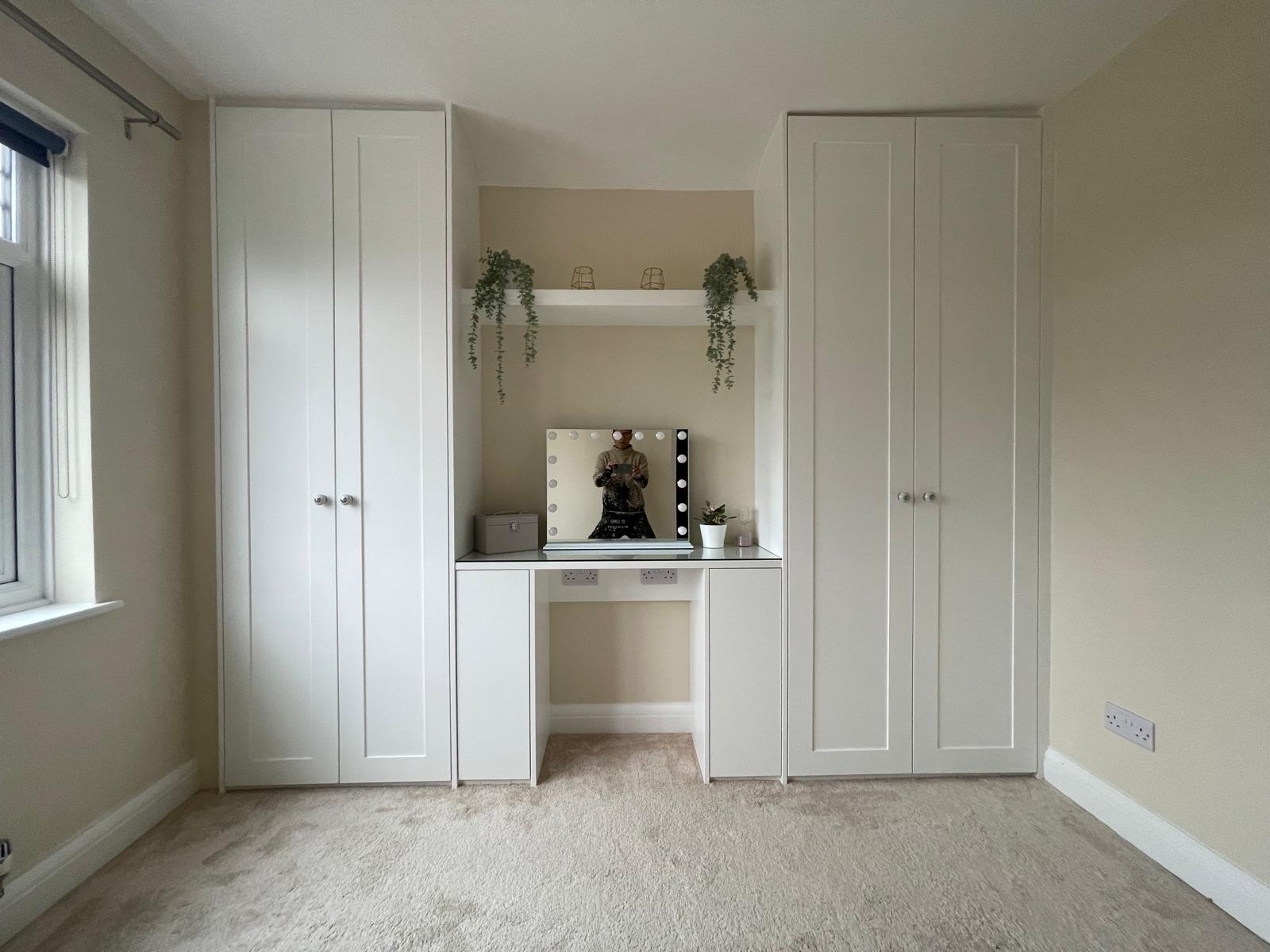 Custom fitted headboard with bedside cabinets in Berkshire bedroom