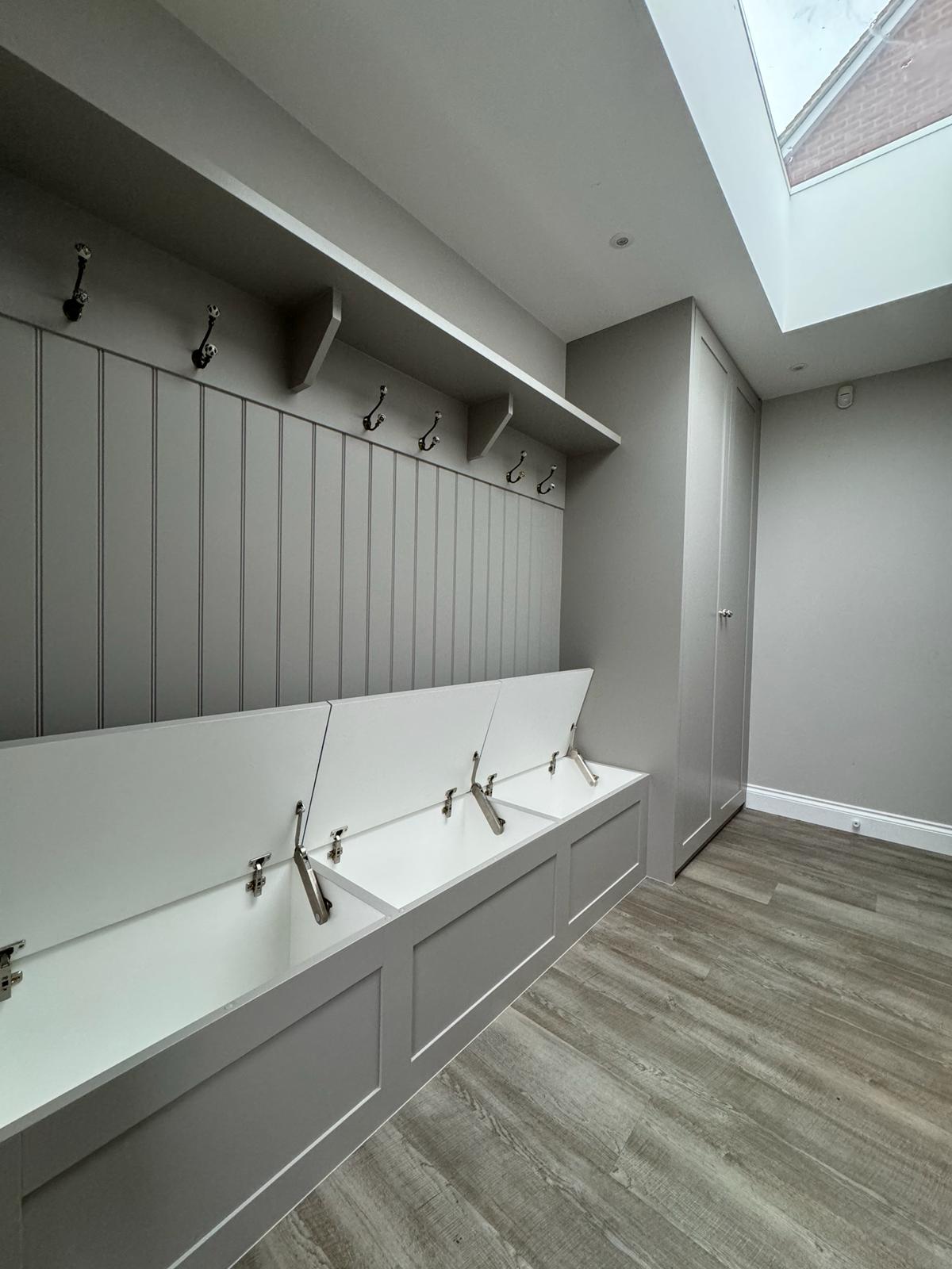 Bespoke fitted hallway with bench and coat cupboards in Windsor