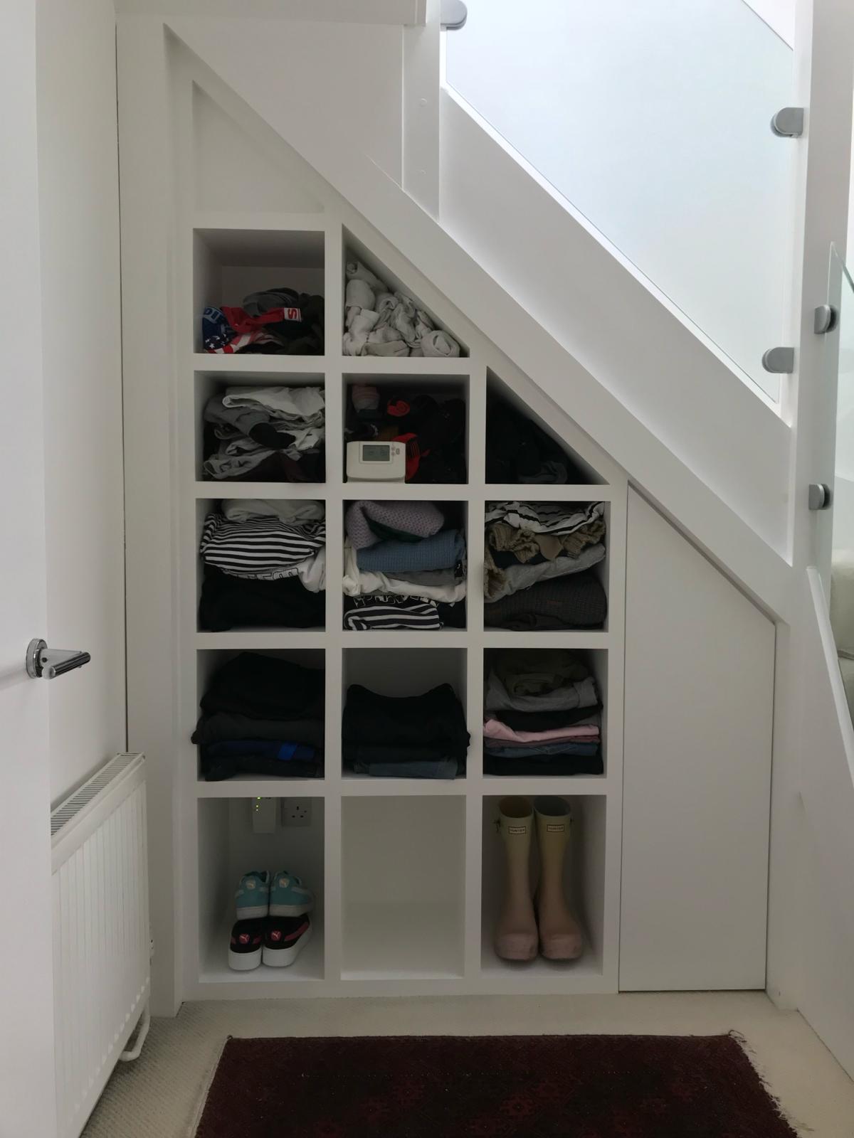 Fitted boot room with bench seating and coat hooks in Windsor