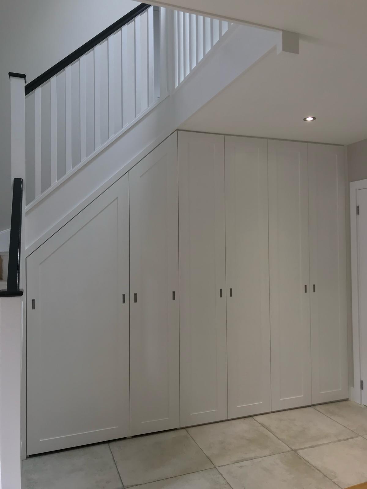 Fitted under-stair cupboard with shelving in Maidenhead home