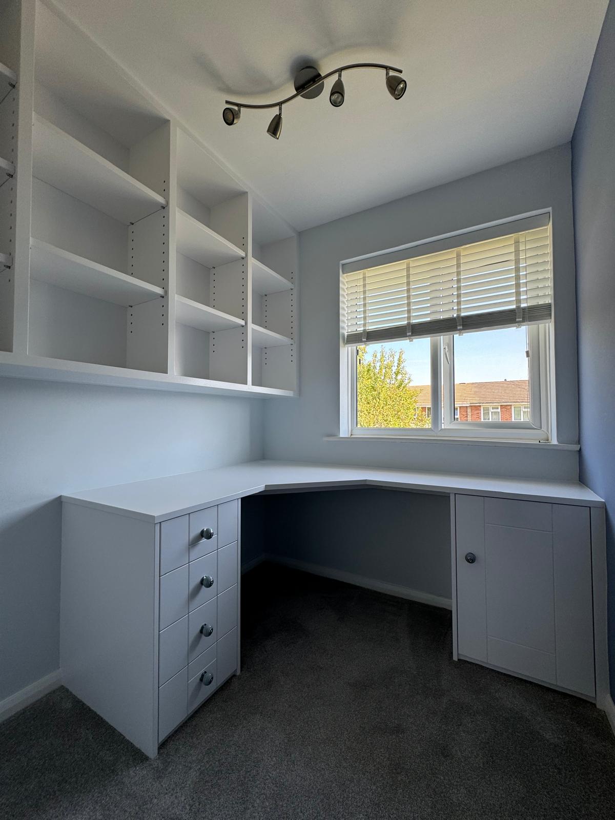 Fitted home office with display shelving in Windsor home