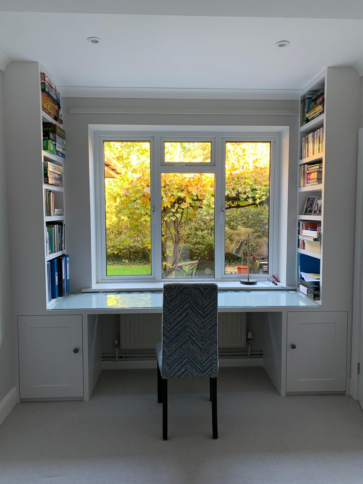 Fitted home office with floor to ceiling bookshelves in Windsor