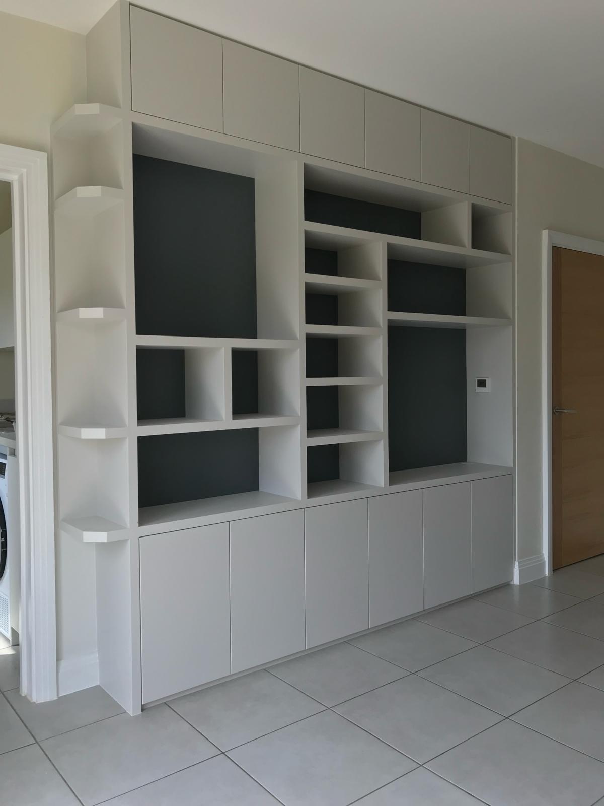 Custom alcove shelving and cabinets in Slough living room