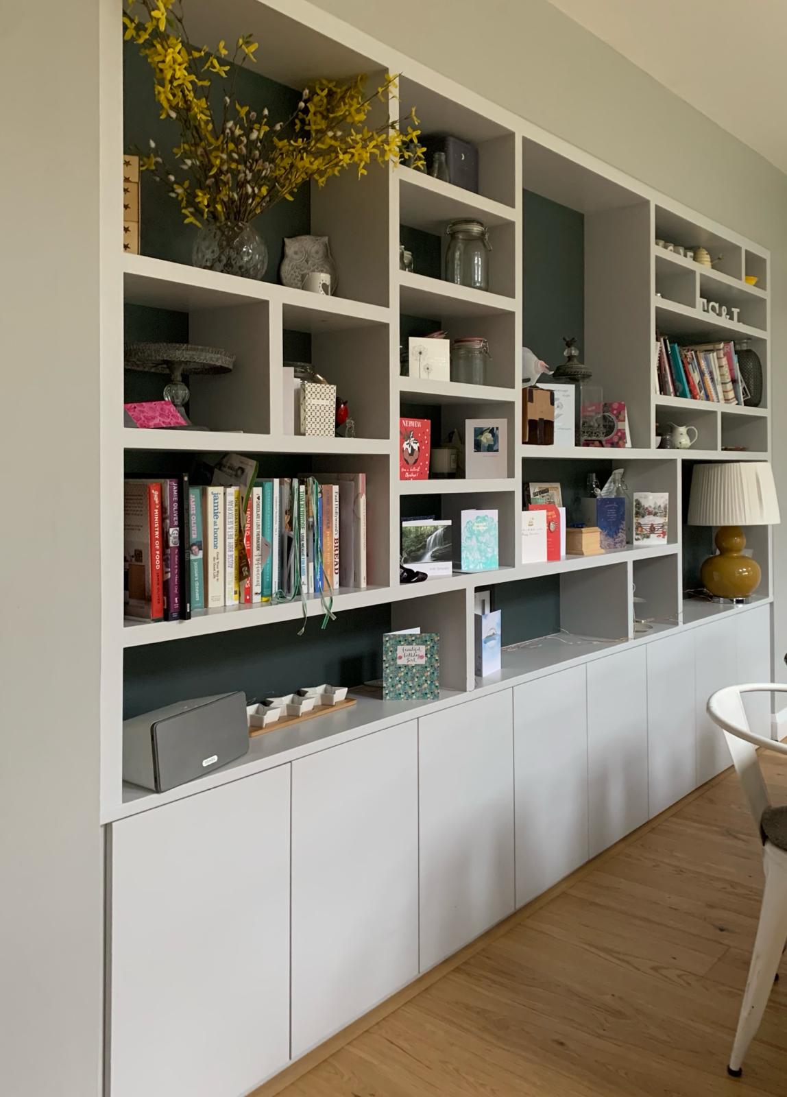 Handcrafted media wall with floating shelves in Berkshire