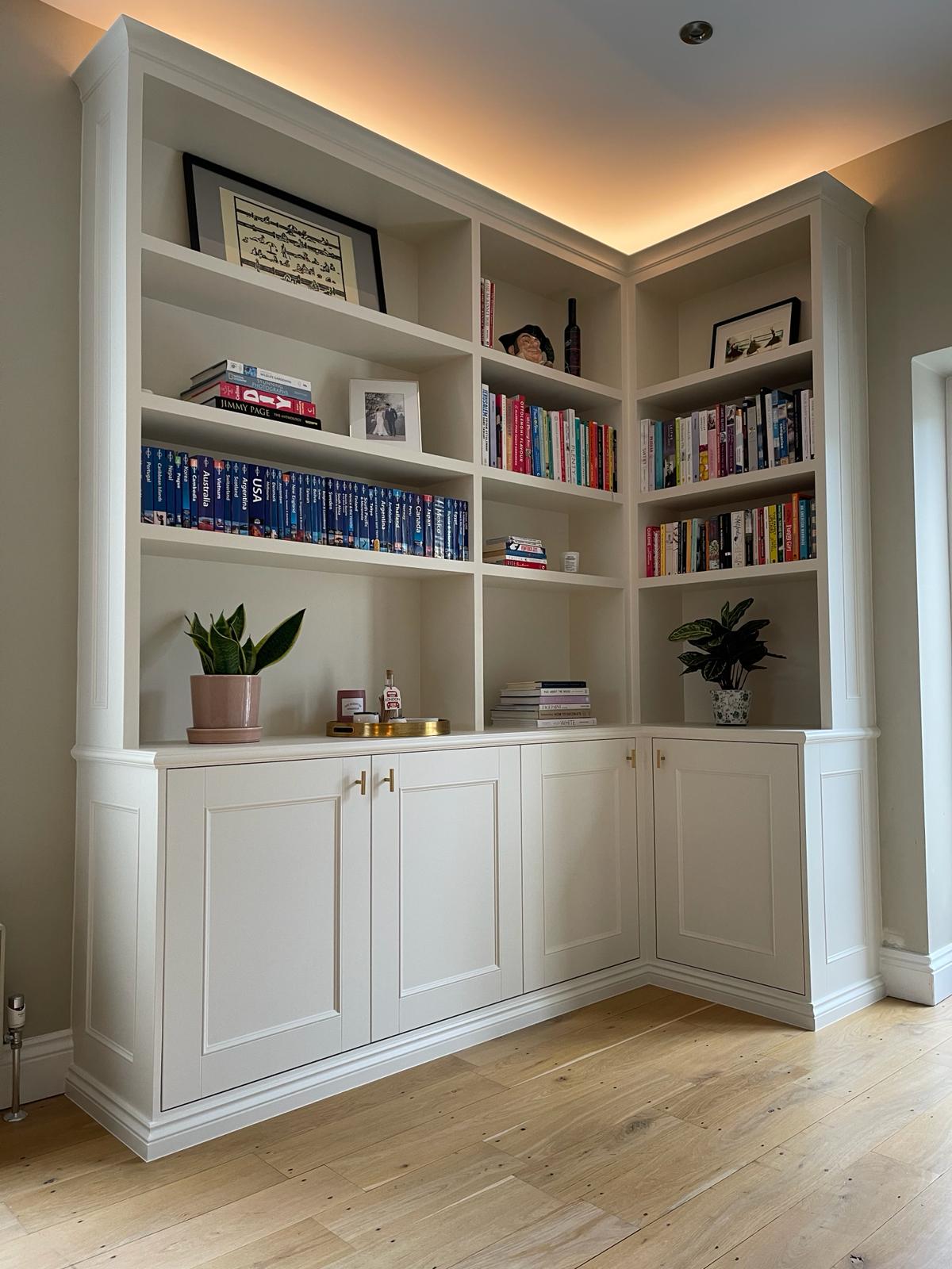 Fitted media wall with shelving in Windsor living room