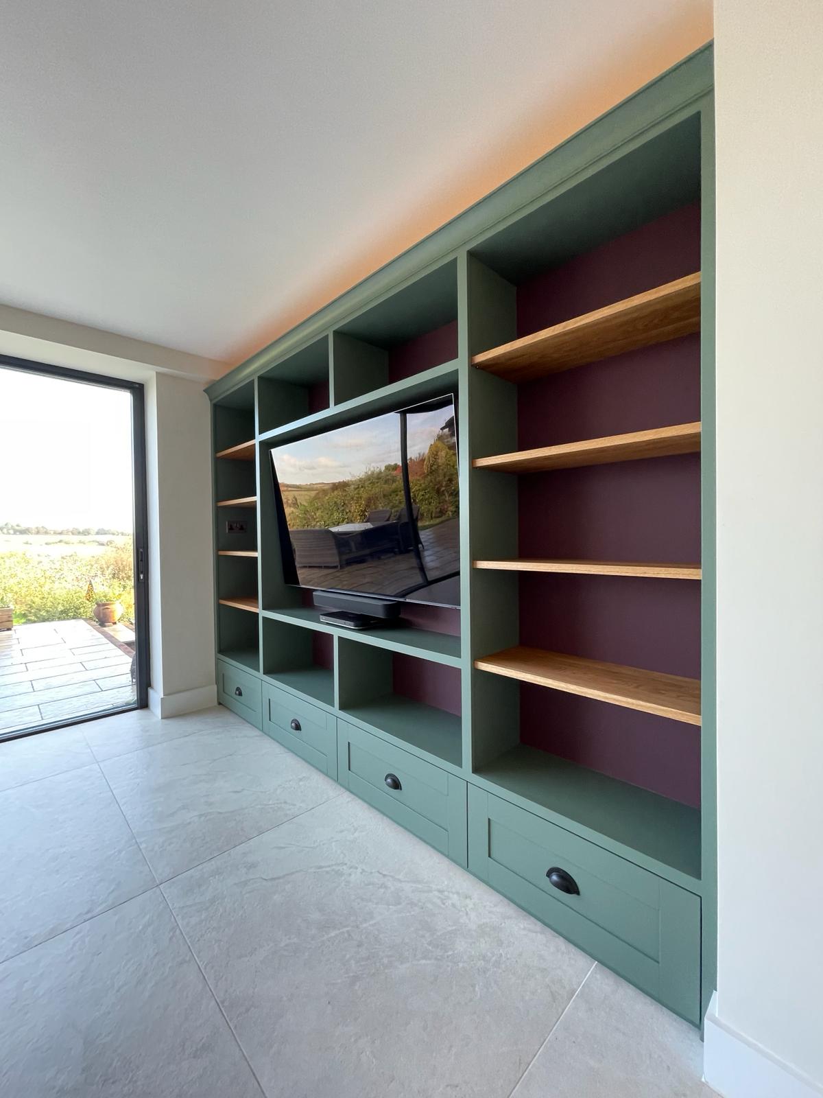 Bespoke fitted living room with painted alcove cabinets in Windsor