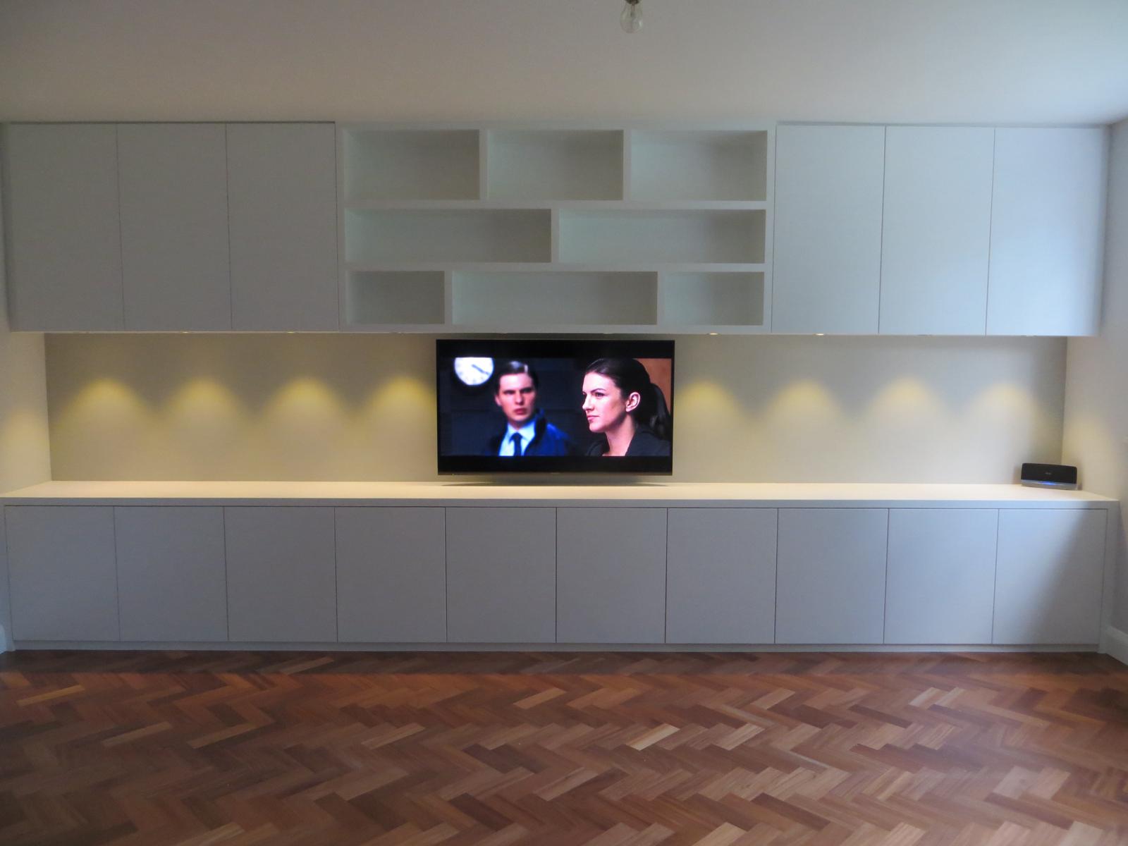 Handcrafted fitted living room cabinetry in Ascot home