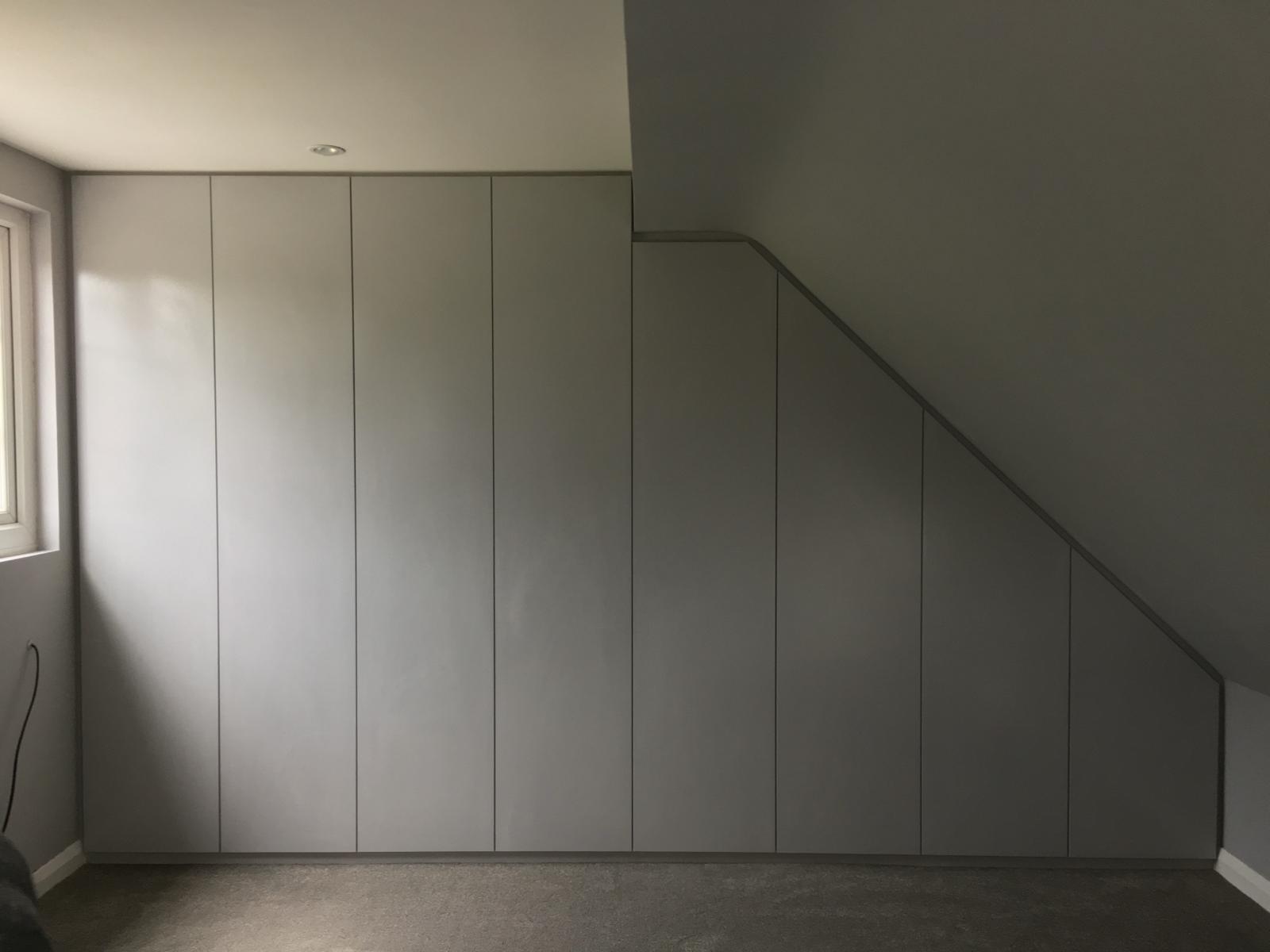 Custom fitted eaves storage and wardrobes in Berkshire loft