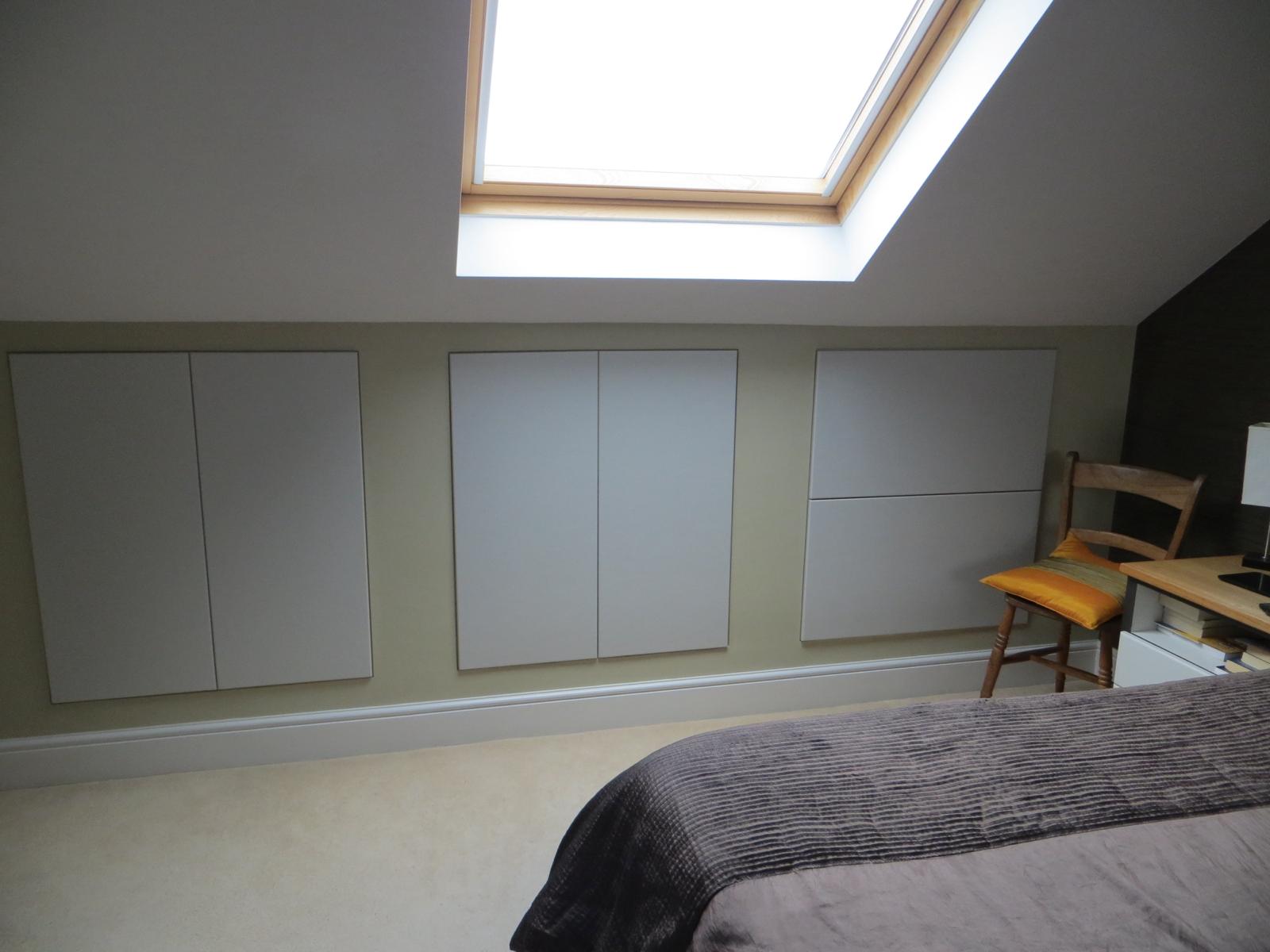 Fitted wardrobes under sloped ceiling in Windsor loft conversion